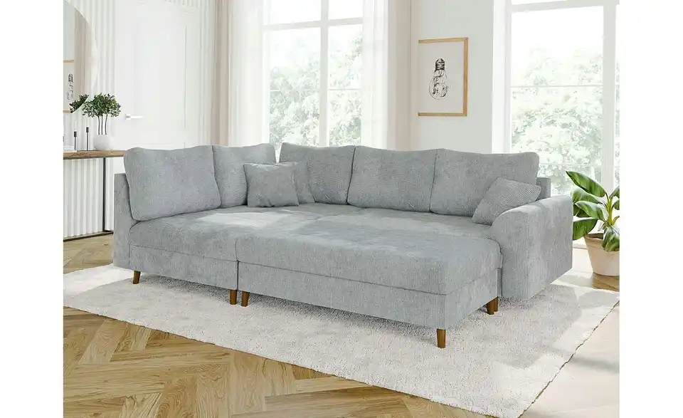 Ecksofa mit Hocker, in Wohnsituation
