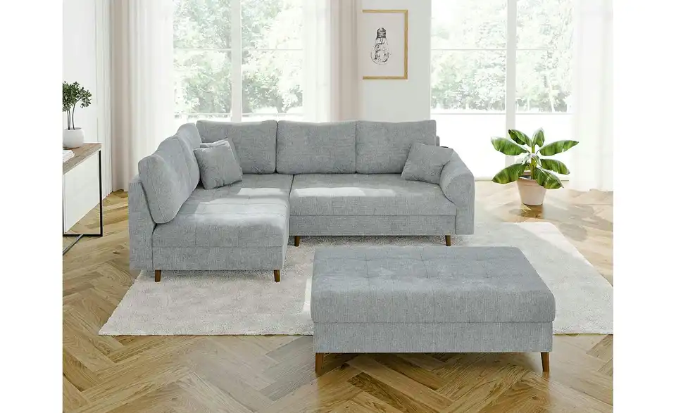 Ecksofa mit Hocker, in Wohnsituation