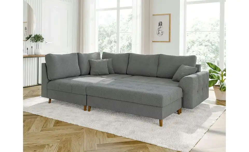Ecksofa mit Hocker, in Wohnsituation