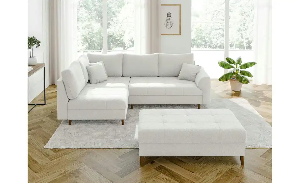 Ecksofa mit Hocker, in Wohnsituation